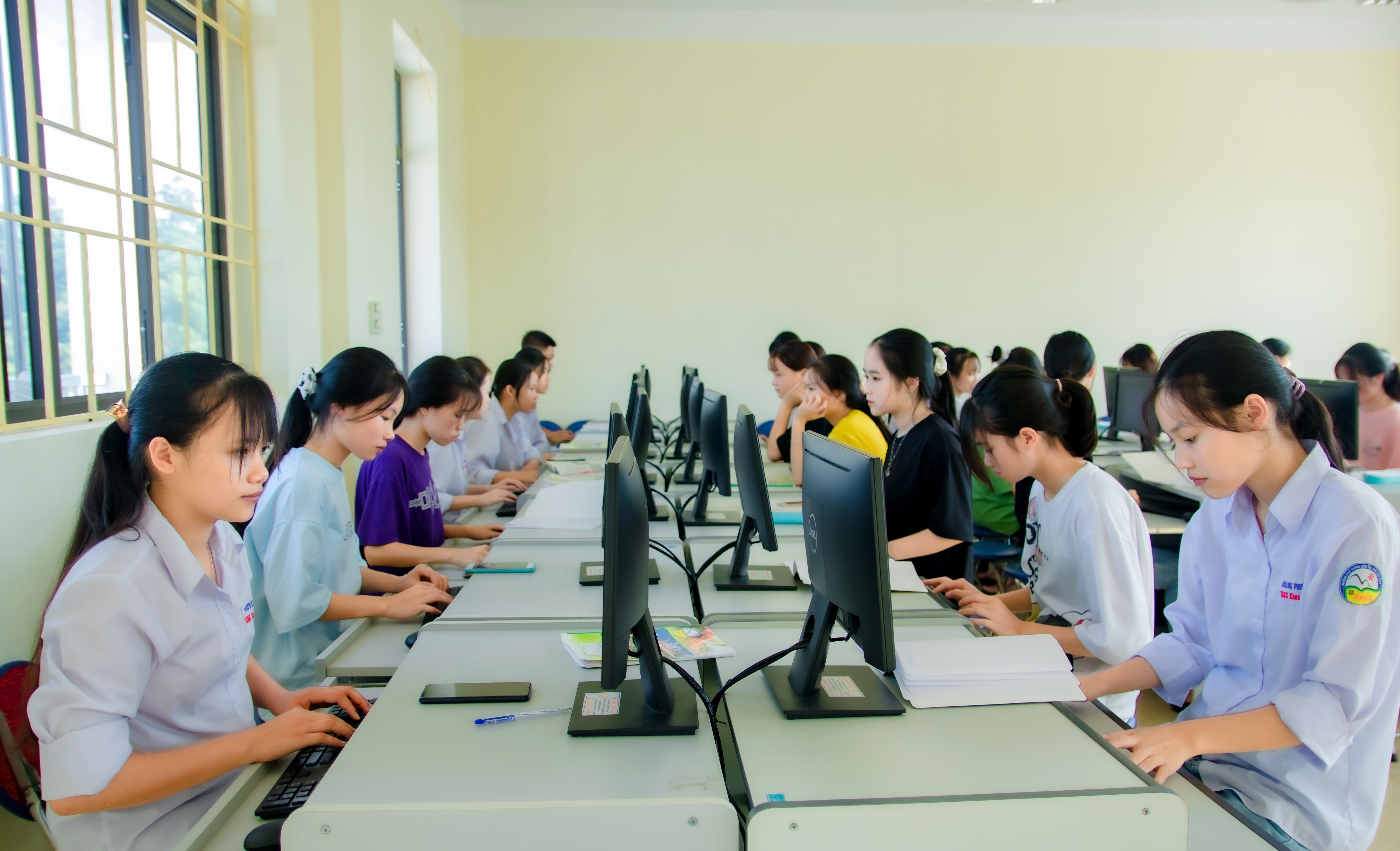 Students working on computers during a classroom technology lesson